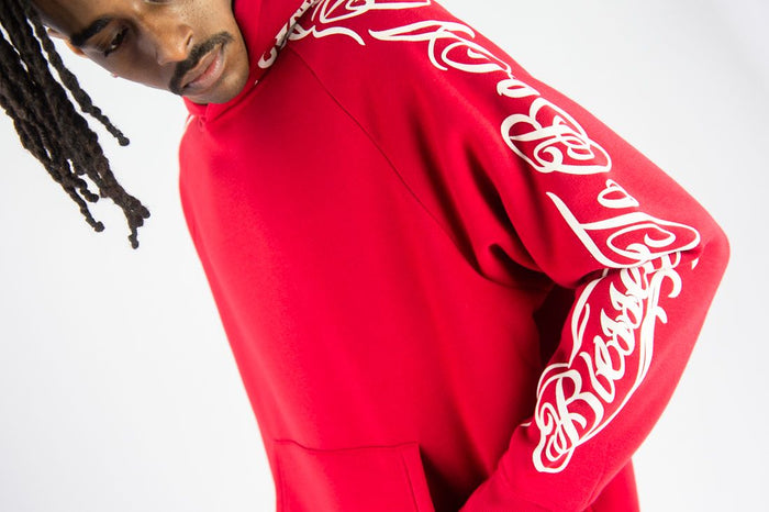 Red Rebel Minds 'Blessed' fleece hoodie shown on a model, featuring a cozy design and bold front lettering.