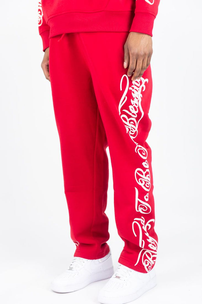 Red Rebel Minds Blessed fleece sweatpants with logo details, comfortable fit, and elastic waistband.