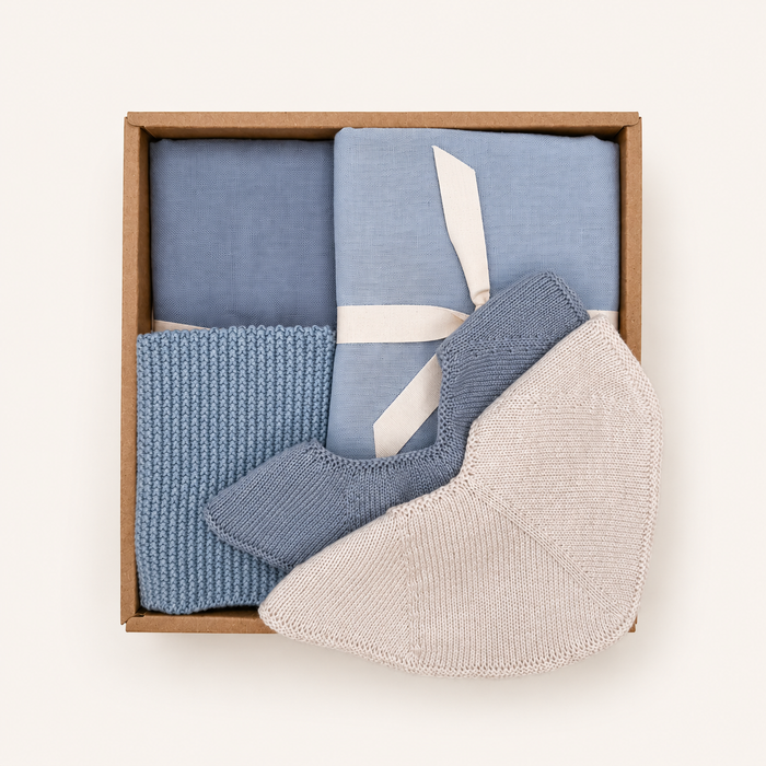 Baby Boy Gift Box with two muslin cloths, two knitted baby bibs and a knitted washcloth in soft blue Scandinavian colours by Saga Copenhagen.