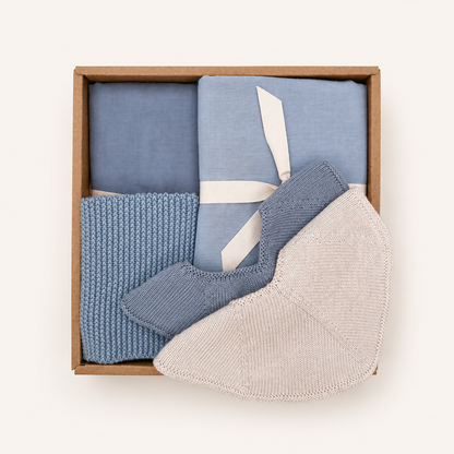 Baby Boy Gift Box with two muslin cloths, two knitted baby bibs and a knitted washcloth in soft blue Scandinavian colours by Saga Copenhagen.