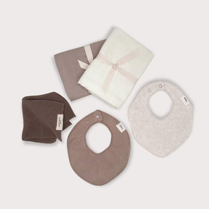Organic baby essentials gift set with muslin cloths, knitted baby bibs and organic washcloth for newborns