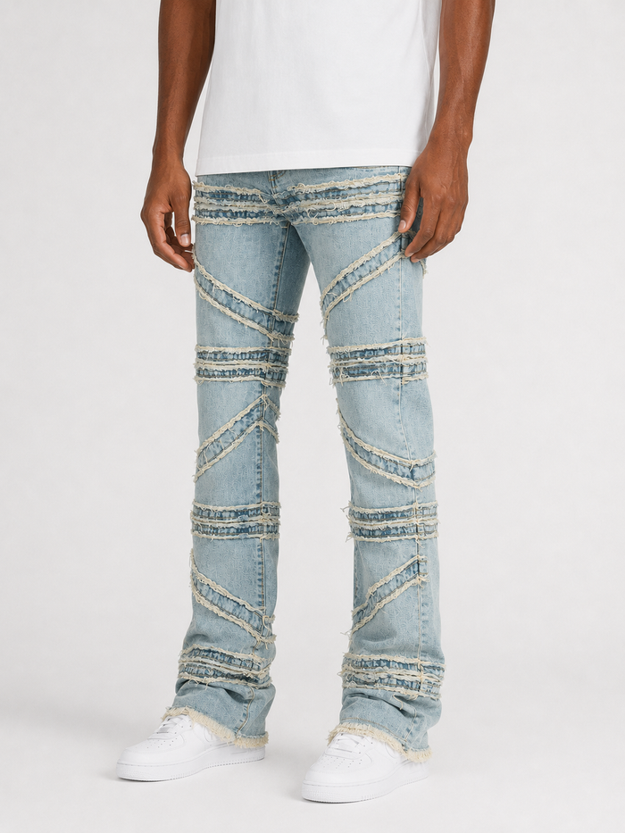 FWRD crossover stacked denim jeans in ice tint with a high-waisted fit and layered design, shown on a model.