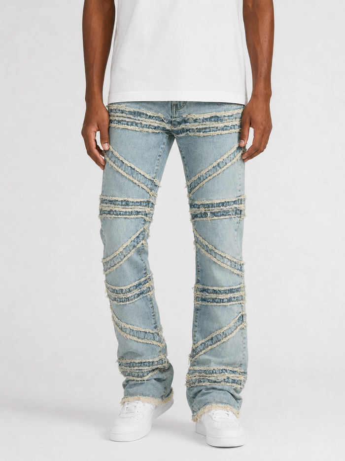 FWRD Crossover Stacked Denim jeans in Ice Tint with layered, distressed design and stacked detailing on the legs.