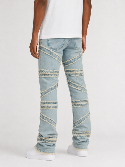 FWRD Crossover Stacked Denim jeans in Ice Tint, showcasing a stacked design and faded blue denim fabric.