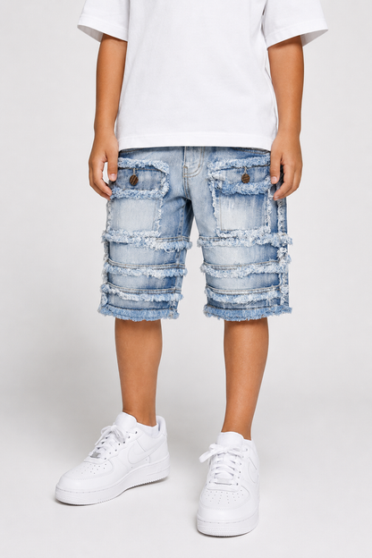 FWRD Kids patchwork denim shorts in ice blue, kids' casual shorts with colorful patchwork design and rolled hem detail.
