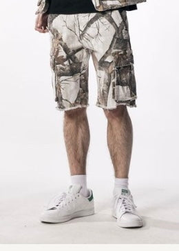 KIND RED Essential Camo Cargo Shorts featuring a green and brown camouflage pattern, multiple cargo pockets, and a relaxed fit.