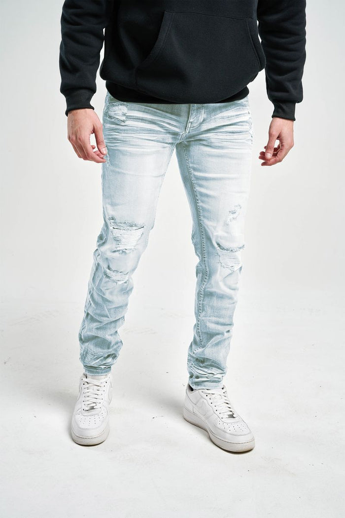 Slim fit stretch denim jeans by Spark, showcasing a close-up of dark blue denim fabric with visible stitching and a classic five-pocket design.